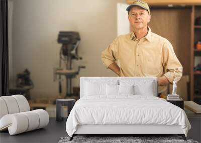 Senior caucasian man in home workshop Wall mural