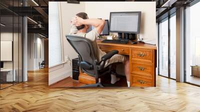 Senior male working in home office Wall mural