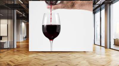 Senior man hand pouring a glass of red wine from a single serving can Wall mural