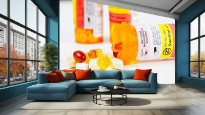 Vitamins spilling from prescription bottle Wall mural