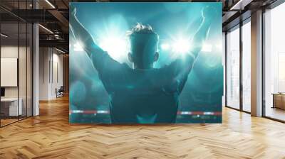 Successful man raising arms after win Wall mural