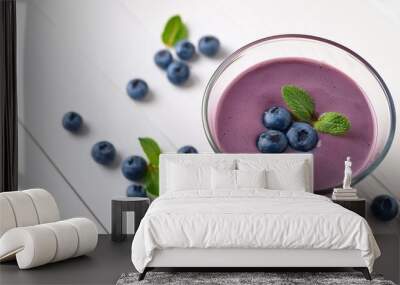 blueberry smoothies juice a tasty healthy drink in a glass drink the morning on white wooden background Wall mural