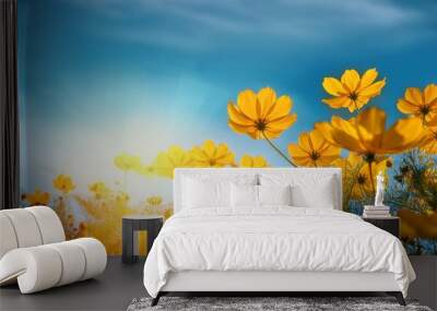 close up yellow cosmos flower on natural blue sky background fresh nature Wall mural