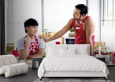 Happy smiling LGBT couple sharing special moment together on Valentine Day, Asian gay male lover having romantic moment during cooking meal at kitchen, celebrate memorable anniversary romantic dating Wall mural