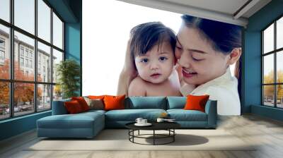 Happy smiling toddle baby on mother shoulder on white background, mom holding and hugging little cute daughter kid, child girl in embrace of parent, love in family, childhood care and motherhood. Wall mural