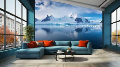 ice covered mountains in polar ocean winter antarctic landscape in blue and white tints the mount s reflection in the crystal clear water the cloudy sky over the massive glacier travel wild nature Wall mural