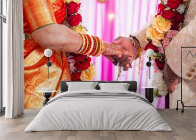 Indian couple's holding hands close up Wall mural