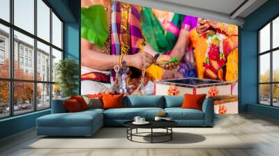 Indian Hindu wedding ceremony and rituals bride and groom's hands close up Wall mural