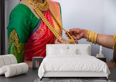 South Indian Tamil bride's wearing her wedding outfit and jewellery close up Wall mural