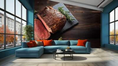 prime rib beef fillet roast on black wooden board background on dark wood table Wall mural