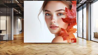 Portrait of beautiful young woman with autumn leafs. Healthy clean fresh skin natural make up beauty eyes on white background  Wall mural