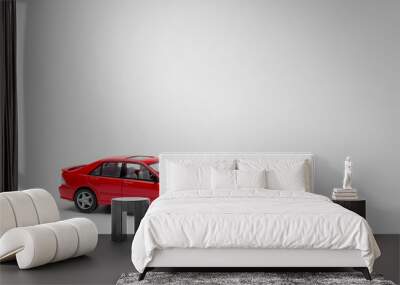 Red Toy car isolated on white background Wall mural