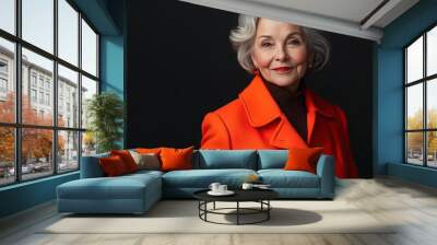 older woman wearing bright peacoat Wall mural