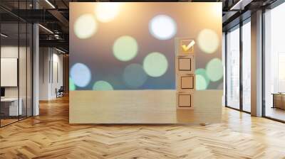 Check your choice on 4 wooden cubes on a beautiful bokeh background Wall mural