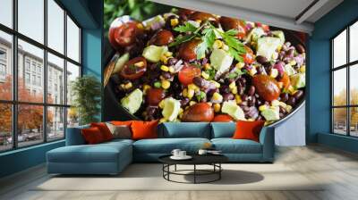 Homemade Mexican black bean and corn salad or Texas caviar bean dip lime dressing, Served with tortilla chips and fresh ingredients. Blurred background. Wall mural