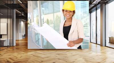 a pretty woman architect on the building construction site Wall mural