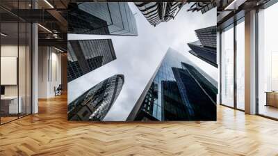 Low angle view of skyscrapers. Looking up perspective. Bottom view of modern skyscrapers in business district. Business concept of success industry Wall mural