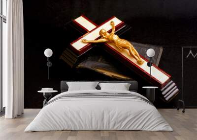 old crucifix laying on top of an ancient leatherbound bible Wall mural