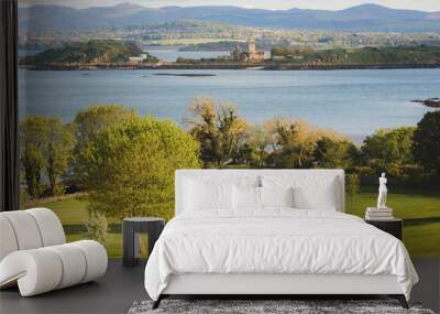 Scenic view of coastal golf hole and green and the Firth of Forth with the historic Inchcolm Abbey and the Pentland Hills from Fife, Scotland. Wall mural