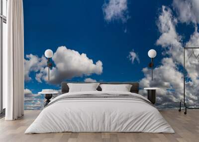 Fantastic clouds against blue sky, panorama Wall mural