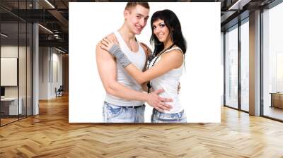 young fitness couple wearing jeans in the studio Wall mural