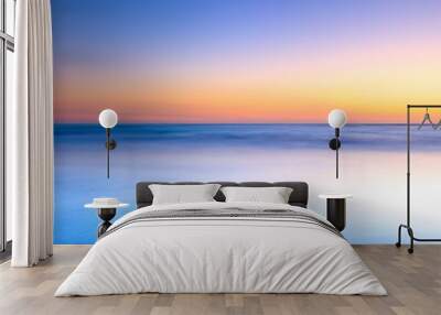 White beach and blue ocean on twilight sunset Wall mural