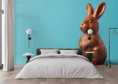 chocolate easter bunny decoration, isolated on blue background. luxury chocolate, easter holiday. delicious milk, dark chocolate bunny. Wall mural