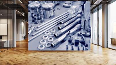 blue toned precision auto engine parts laid out in a workshop Wall mural