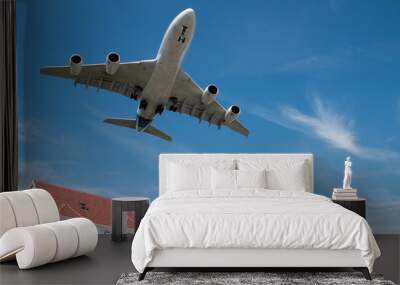 large jet aircraft on landing over suburban housing Wall mural