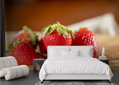 Strawberries on wooden cutting board Wall mural