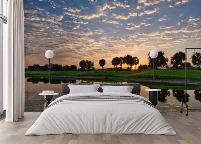 sunrise water reflection at a golf course Wall mural