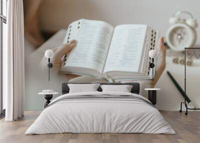 A woman reading the Bible in the morning Wall mural