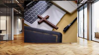 Cross on bible with headset and laptop in online study bible concept. Wall mural