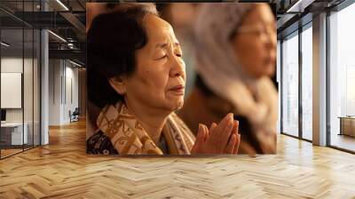 Faithful followers in prayer during a service Wall mural