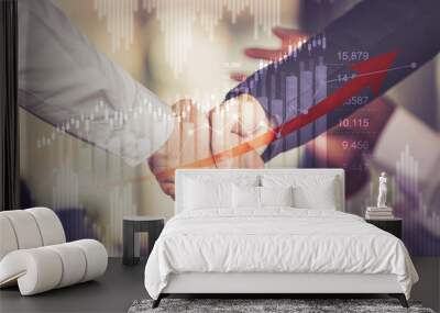 Hand shake between businessman on Trading graph wth business financial concept Wall mural