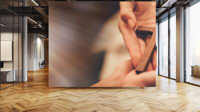 Woman's hand with cross .Concept of hope, faith, christianity, religion, church online. Wall mural