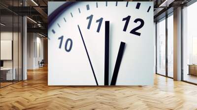 close close-up of clock face. hands pointing to twelve. midday Wall mural