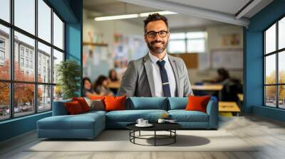 handsome teacher standing in school classroom with blurred background, lecturer Wall mural