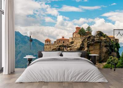 The Great Meteoron Monastery, in the complex of Meteora, Greece. Touristic destination. Beautiful blue sky with clouds in the background Wall mural