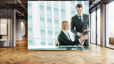 businessman and woman discussing in office Wall mural