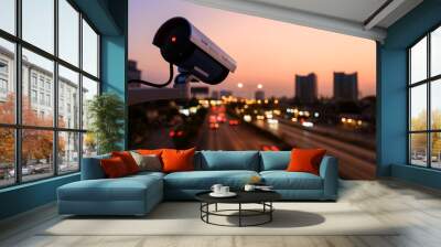 CCTV, Surveillance camera operating in city watching traffic road with beautiful twilight sky Wall mural