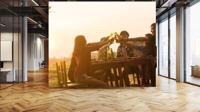 Group of 6 teenager have dinner party celebrating at sunset with beautiful landscape background Wall mural