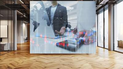 Two businessman work with laptop and diagram of stock market exchange technology Wall mural