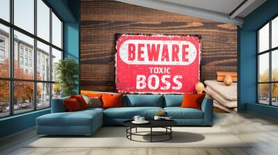 Toxic Boss. Beware sign with text on a wooden texture office table Wall mural