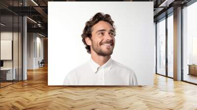 Close up head shot confident handsome smiling young man in white shirt looking aside, isolated on grey white studio background. Studio portrait of happy millennial guy with beard and brown hair. Wall mural