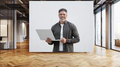 Middle age freelance entrepreneur, latin hispanic businessman holding laptop computer, looking at camera. Mature 40s Indian handsome man using wireless pc for business, isolated on white background Wall mural