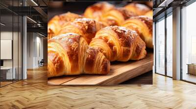 A row of French croissants on the table for breakfast Wall mural