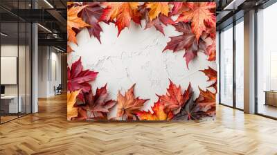 Red and orange autumn leaves on a white background, copy space for text, top view, flat lay Wall mural