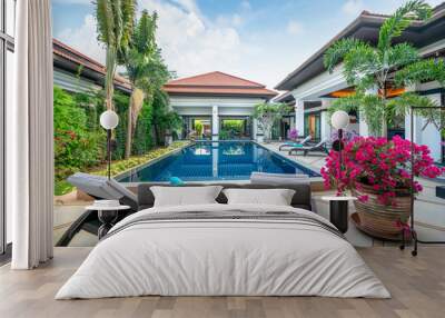 home or house building  Exterior  and interior design showing tropical pool villa with green garden, with sun bed and blue sky  Wall mural