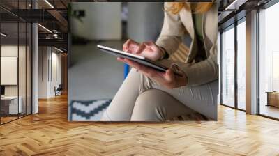 Females hands holding digital tablet	 Wall mural